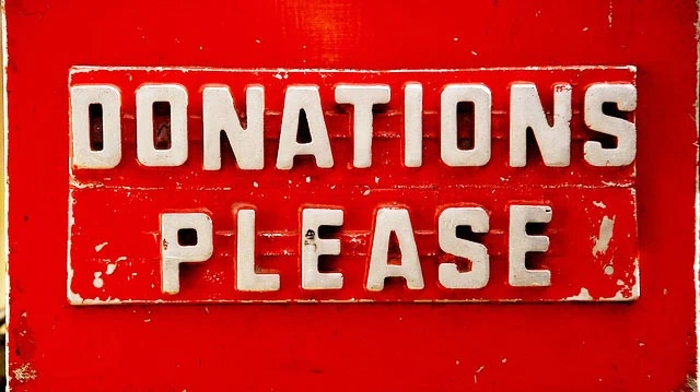 "DONATIONS PLEASE" by Michael Clark licensed under CC BY 2.0