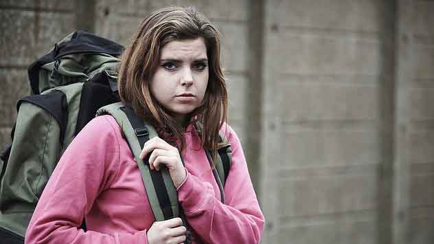 "Homeless teenage girl on street with rucksack" by U.S. Department of Agriculture licensed under CC BY 2.0