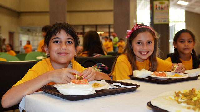 "Summer kids eat lunch" by U.S. Department of Agriculture licensed under CC BY 2.0