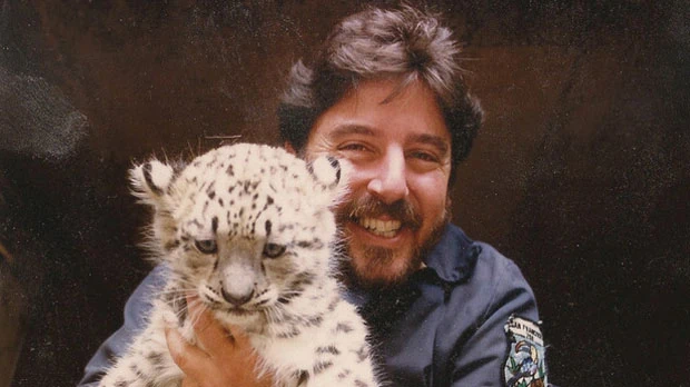 "Norman Gershenz Director, CEO, and, Co-Founder of SaveNature.Org with a Snow Leopard Cub" Photo courtesy of SaveNature.Org